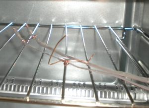 Thermistor and wire assembly attached to the inside of my toaster oven.